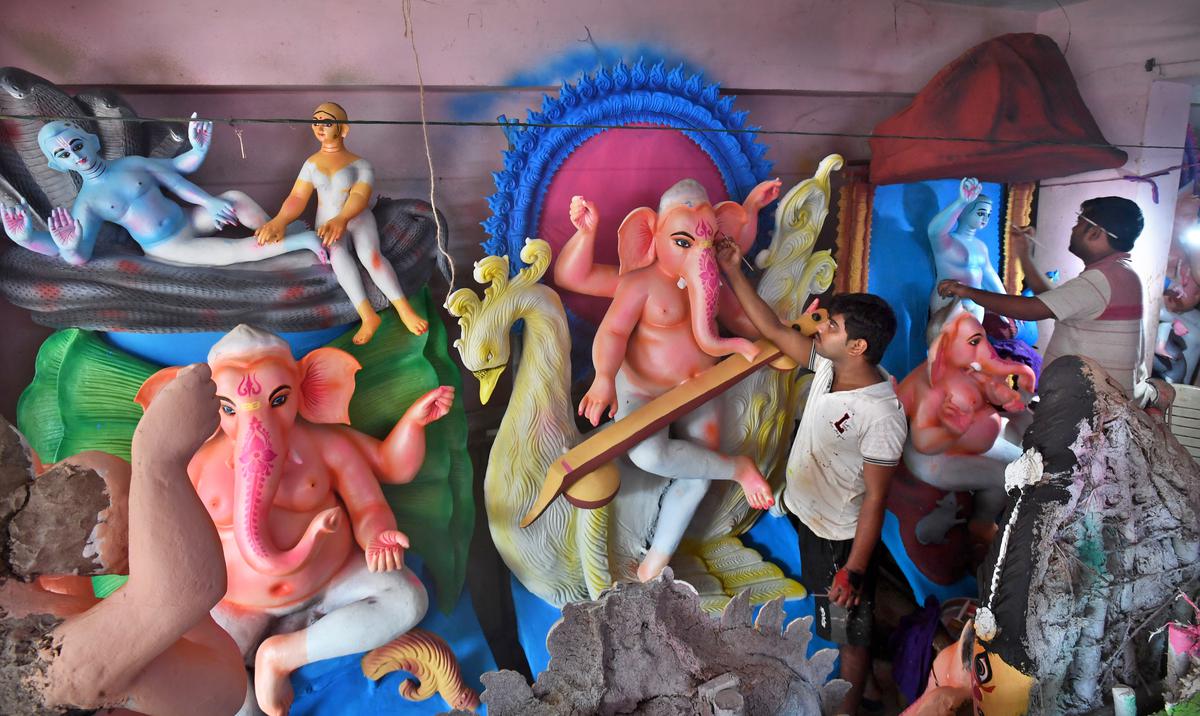 Idol makers from West Bengal make Ganesha idols from clay brought from the banks of the Ganges near Mahatma Gandhi Grandhalm, RP Peta in Kanchrapalem, Visakhapatnam
