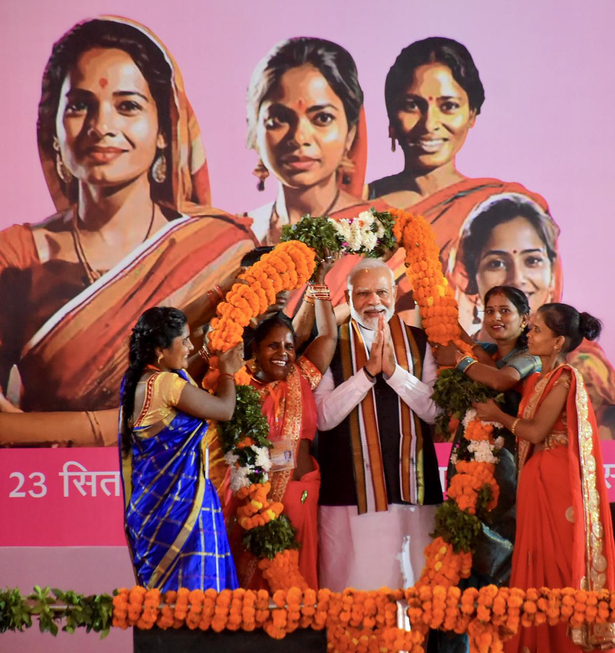 Varanasi: Prime Minister Narendra Modi being garlanded during an interaction with women on the Women’s Reservation Bill, in Varanasi, Saturday, Sept. 23, 2023.