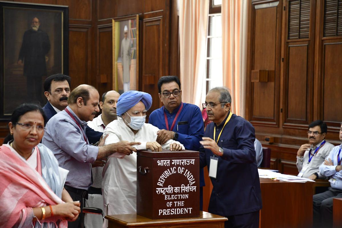 Former Prime Minister Manmohan Singh casts his vote for the Presidential Election at the Parliament house, in New Delhi, on July 18. 