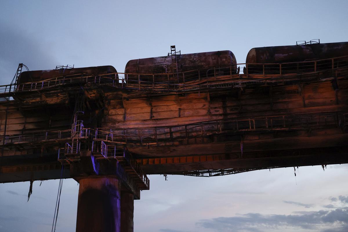 A view of burnt tanks on a damaged part of the Crimean Bridge connecting Russian mainland and Crimean peninsula over the Kerch Strait, near Kerch, Crimea, on October 8, 2022. Photo credit: AP