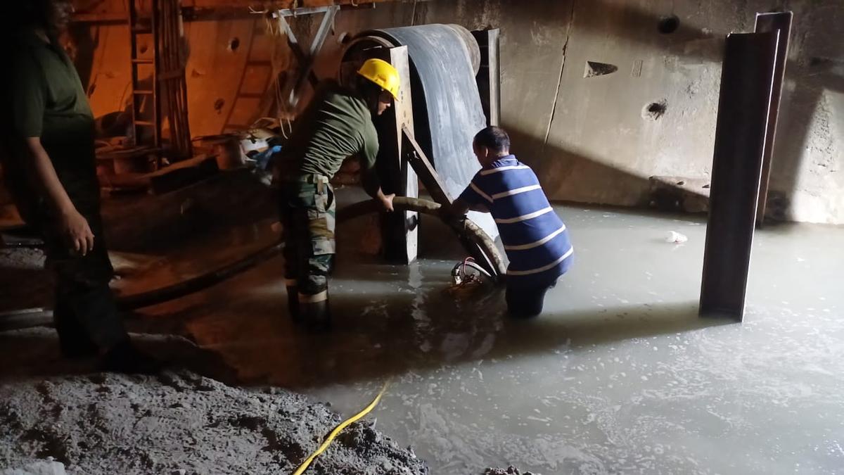 Indian Army personnel participate in the dewatering process in the SLBC tunnel on Tuesday.