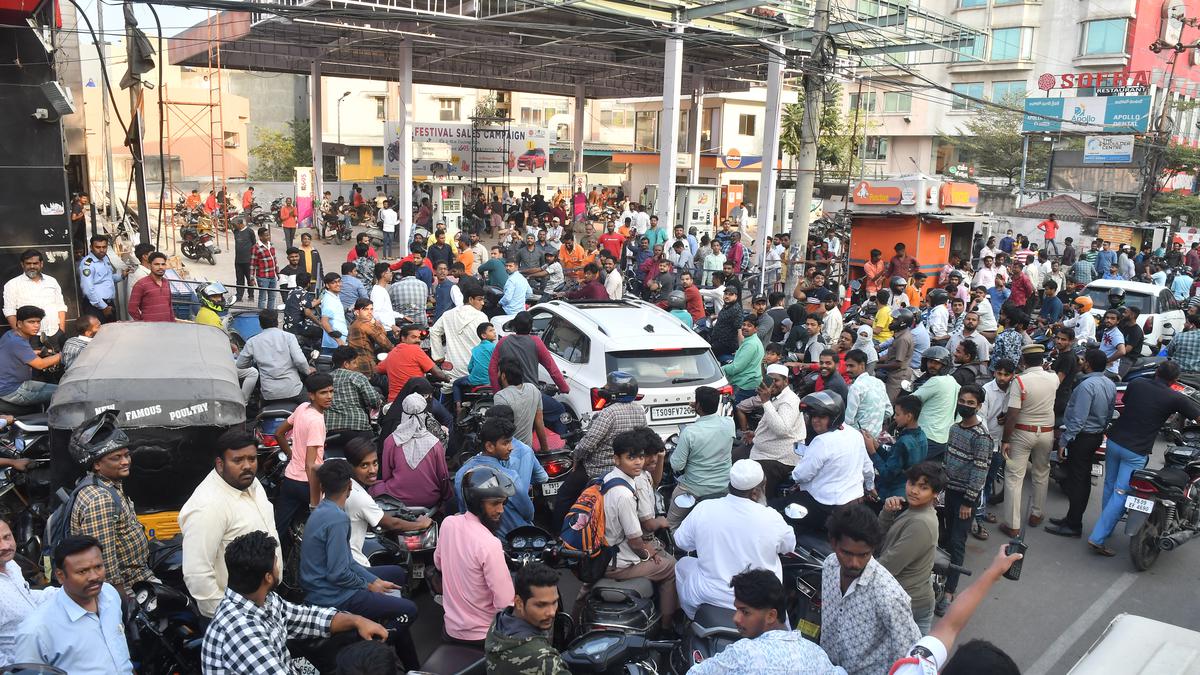 Rush at fuel stations gridlocks evening city traffic