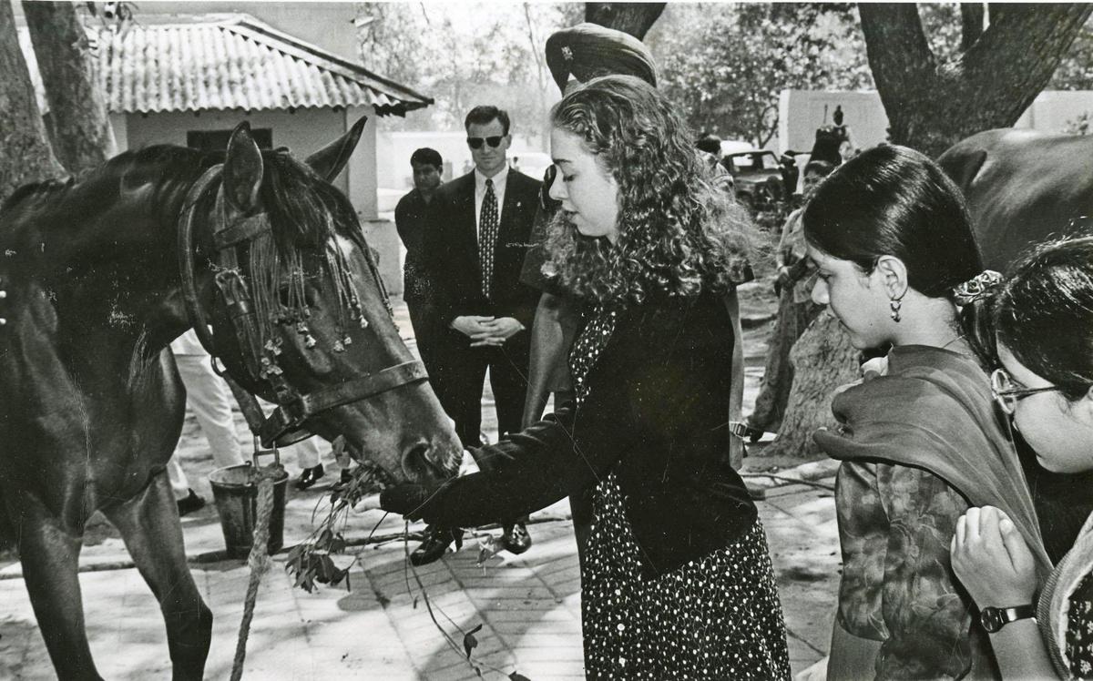 Ms. Chelsea Clinton, daughter of the U.S. President, feeding a President's Bodyguard horse when she went around the Rashtrapati Bhavan on March 29, 1995. The President Dr. Shankar Dayal Sharma's grand daughters are also seen in the picture. Ms. Chelsea Clinton, daughter of the U.S. President, feeding a President's Bodyguard horse when she went around the Rashtrapati Bhavan on March 29, 1995. The President Dr. Shankar Dayal Sharma's grand daughters are also seen in the picture.