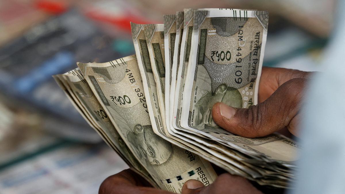 Rupee slumps 52 paise to close at 87.43 against U.S. dollar