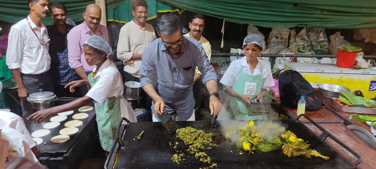 MB Rajesh, Minister for Local Self Governments, Rural Development and Excise, Government of Kerala, trying his hand at cooking Vanasundari chicken at Keraleeyam in Thiruvananthapuram