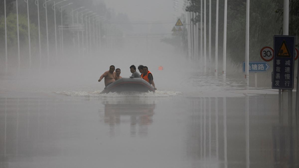 What caused the record rainfall in Beijing and northern China?