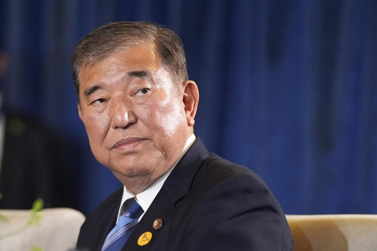 Prime Minister of Japan Shigeru Ishiba sits during a trilateral meeting with President Joe Biden and the President of South Korea Yoon Suk Yeol in Lima, Peru, Friday, Nov. 15, 2024. 