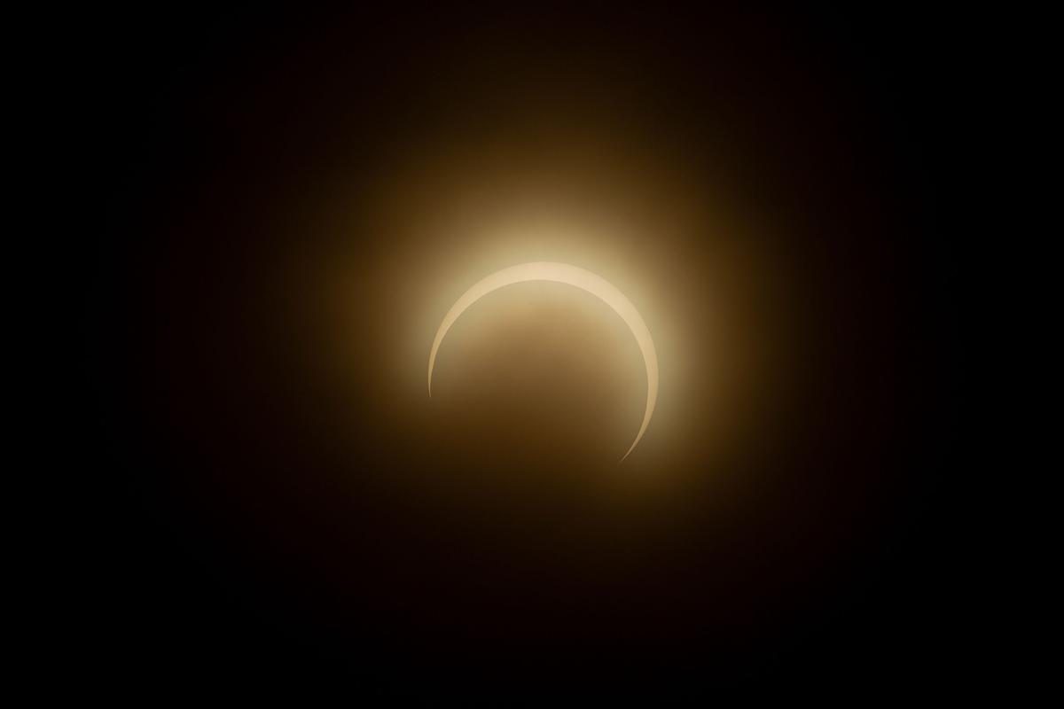 The moon crosses in front of the sun during the annular solar eclipse as smoke haze from fires in the Amazon rainforest blankets the sky in Manaus, Amazonas State, northern Brazil, on October 14, 2023. Skygazers across the Americas turned their faces upwards Saturday for a rare celestial event: an annular solar eclipse. 