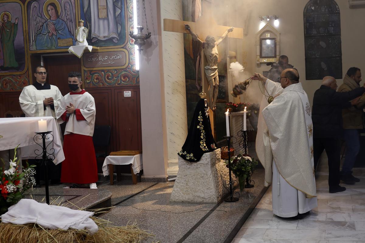 Midnight Christmas Eve mass at Deir Al Latin Holy Family Catholic Church in Gaza City. Midnight Christmas Eve mass at Deir Al Latin Holy Family Catholic Church in Gaza City.