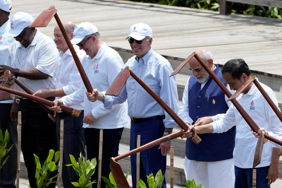 South African President Cyril Ramaphosa, German Chancellor Olaf Scholz, Australian Prime Minister Anthony Albanese, U. S. President Joe Biden, Indian Prime Minister Narendra Modi and Indonesian President Joko Widodo participate in a mangrove planting event at Ngurah Rai Forest Park, on the sidelines of the G20 summit in Denpasar, Bali, Indonesia, on November 16, 2022