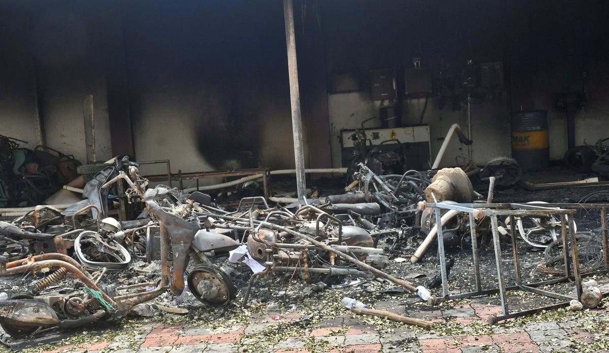 Vehicles that were torched by protestors in front of Sakthi Matriculation Higher Secondary School at Kaniyamoor near Chinna Salem in Kallakurichi district on July 17, 2022