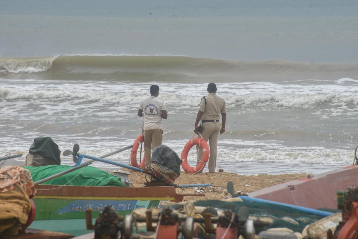 Security personnel monitoring the beach at Kothapatnam seashore in Prakasam district on Monday (October 27).
