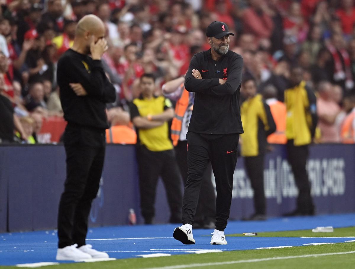 Liverpool manager Juergen Klopp looks on as Manchester City manager Pep Guardiola reacts during the Community Shield match