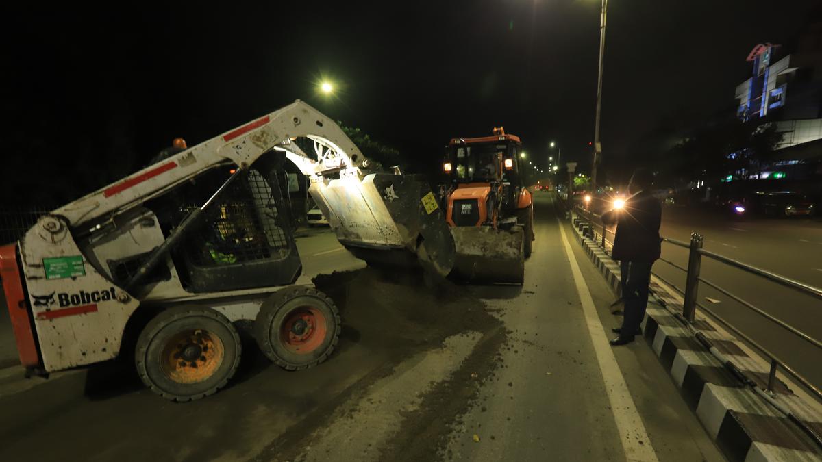 Clearing a sand spill at the midnight hour on Thiru-Vi-Ka bridge