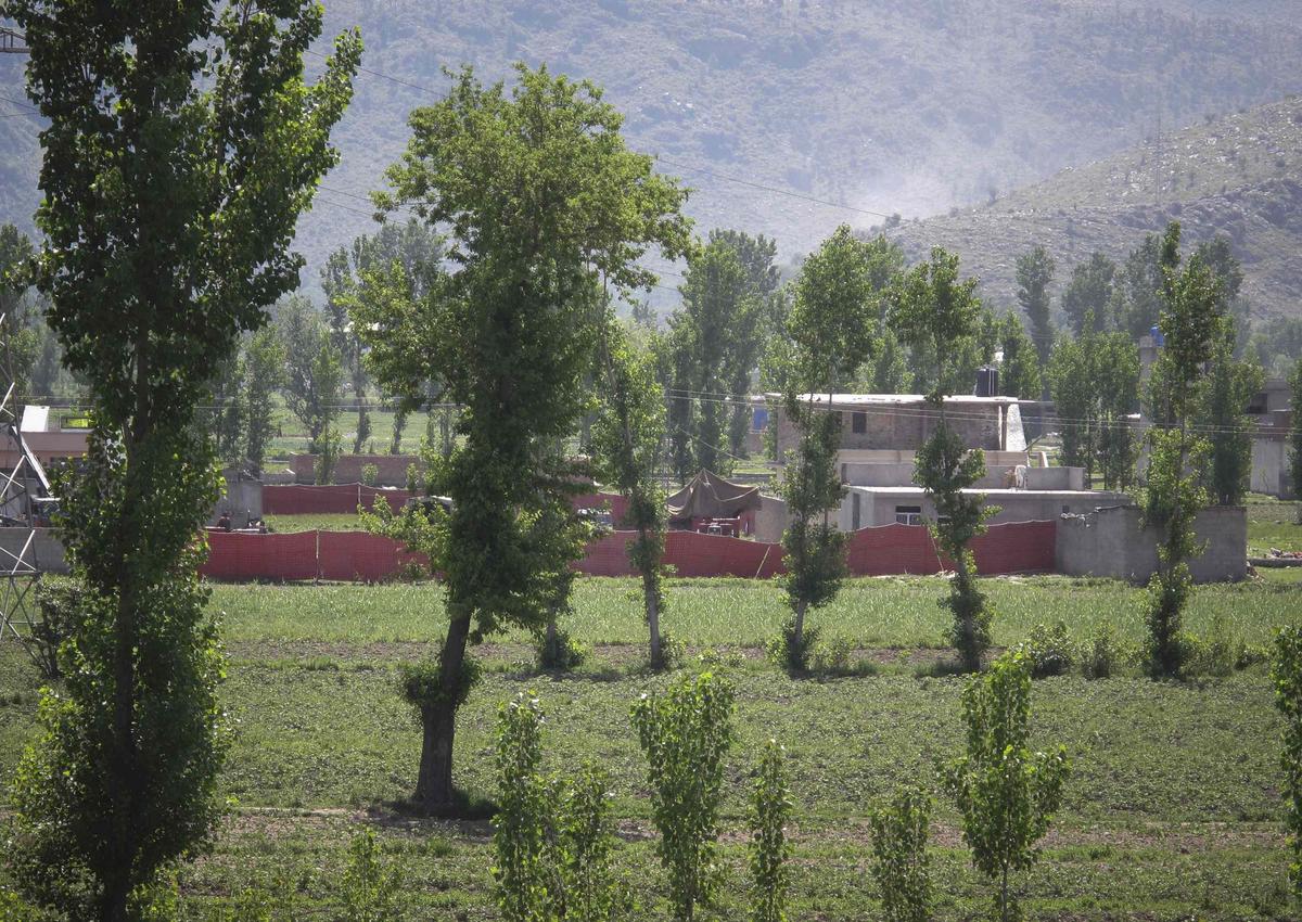 Surrounded in red fabric, a compound is seen where locals reported a firefight took place overnight in Abbotabad, located in Pakistan’s Khyber Pakhtunkhwa province on May 2, 2011. Al Qaeda leader Osama bin Laden was killed in a firefight with U.S. forces in Pakistan ending a nearly 10-year worldwide hunt for the mastermind of the Sept. 11 attacks. 