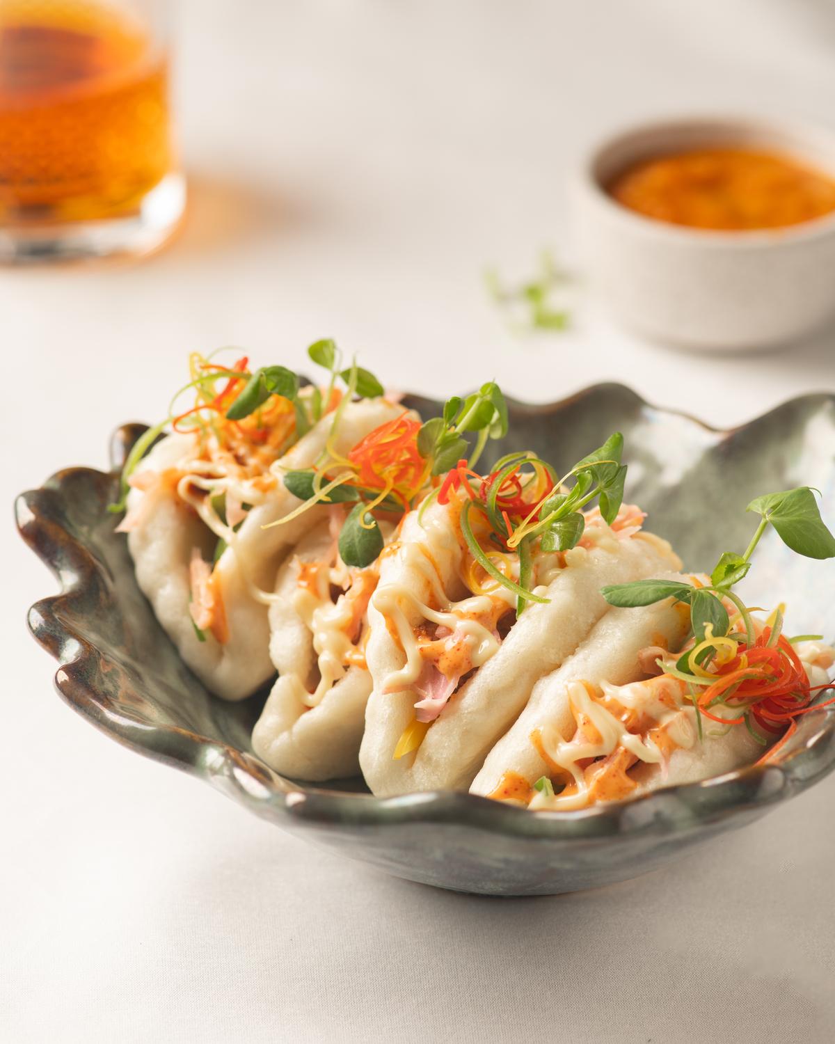 Baos are stuffed with succulent jackfruit and salted bok choy Baos are stuffed with succulent jackfruit and salted bok choy