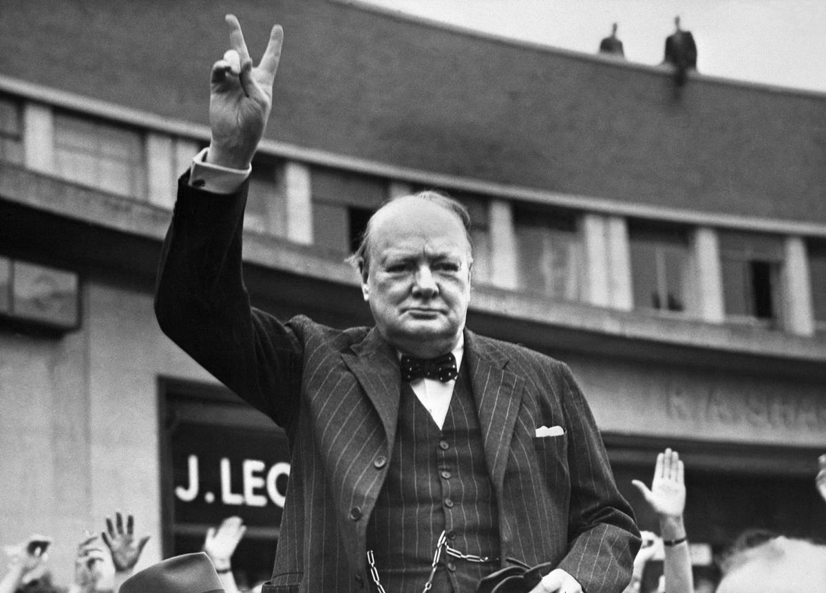 Britain’s Sir Winston Churchill flashing the V-sign for victory.