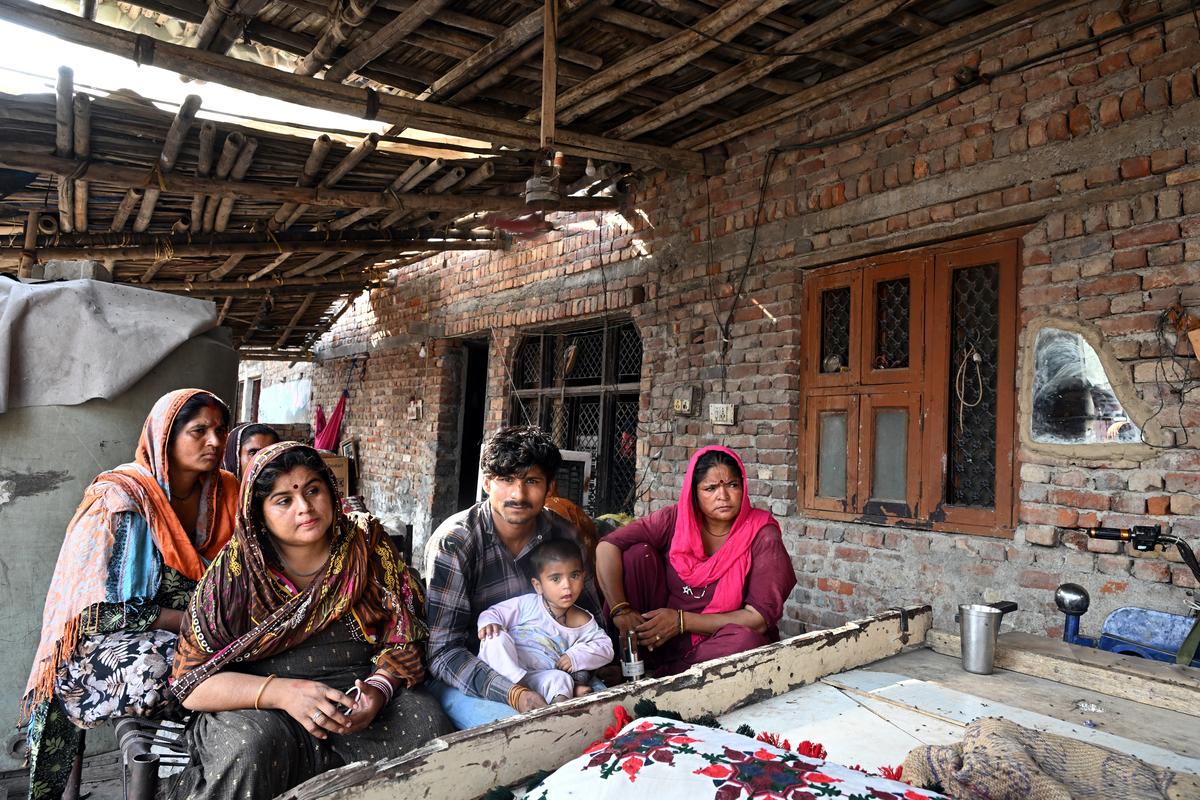 Kesari Bagri (in brown) at the refugee camp in Rohini.