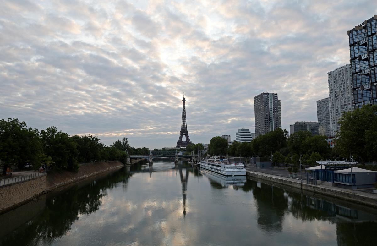 A reflection of the Eiffel Tower is seen in the Seine river on July 25, 2024.