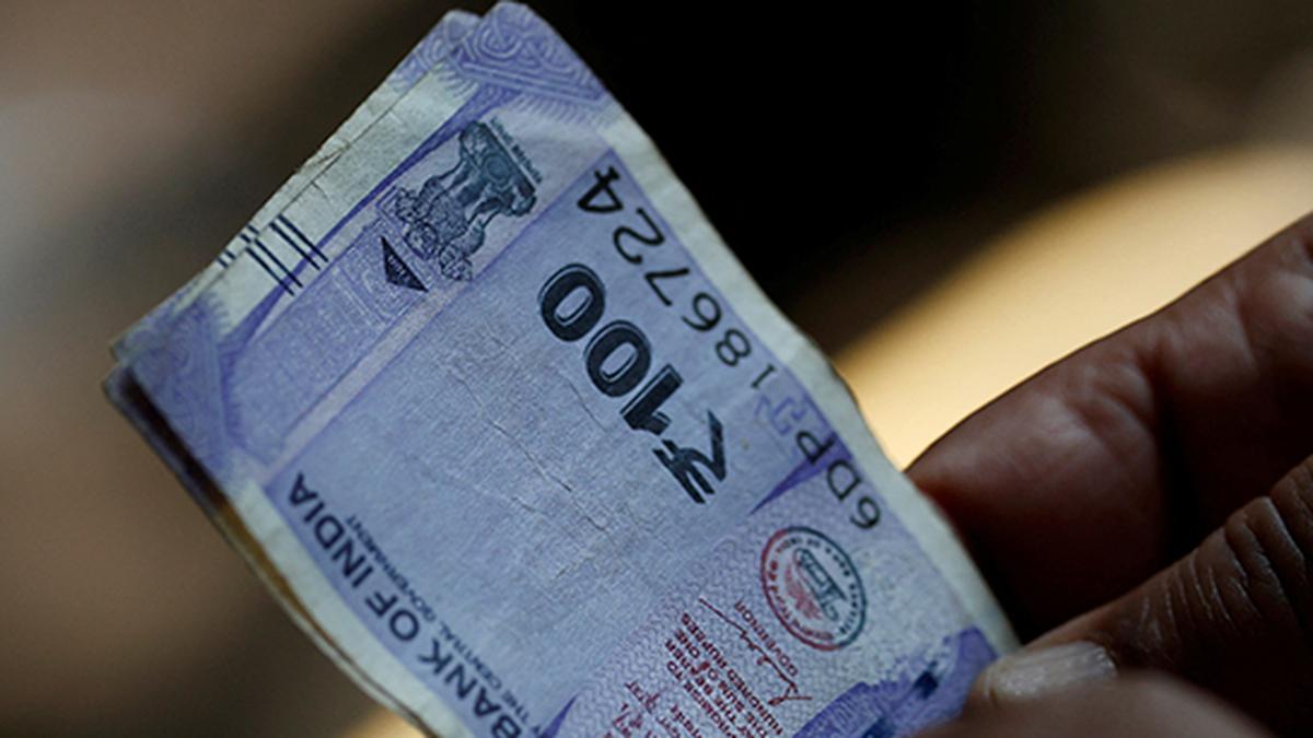 Rupee trades in narrow range against U.S. dollar in early trade