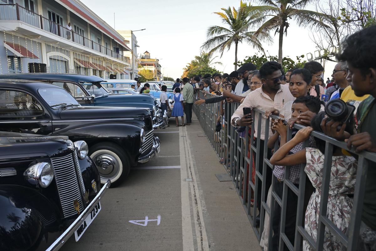 Visitors looking at the Heritage Cars at the Exhibition organised by Tourism Department on Beach Road in Puducherry on Monday. 