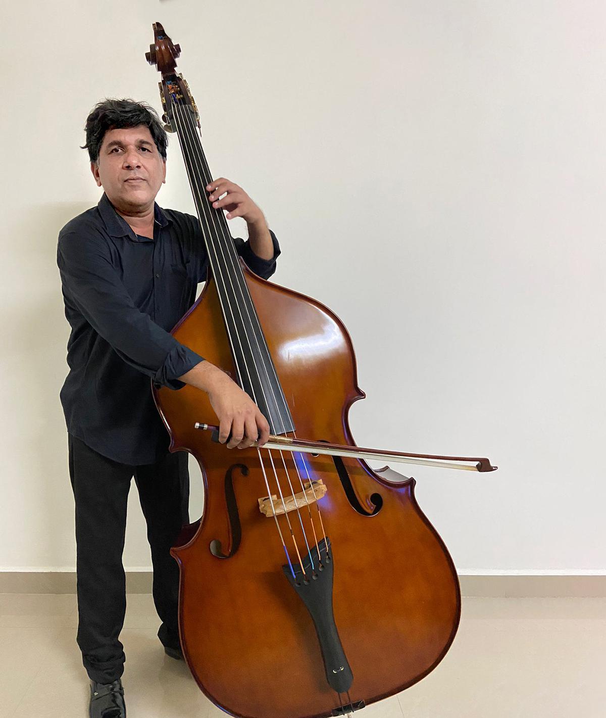 Chennai-based Francis Rosario seen with his five-stringed double bass made in Germany.