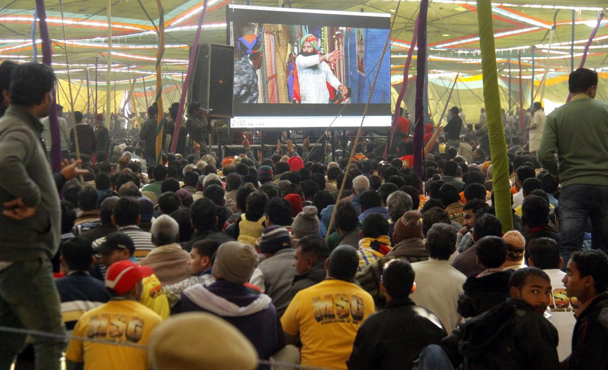 Dera followers at a press conference held ahead of the release of a movie of Gurmeet Ram Rahim in 2015. 