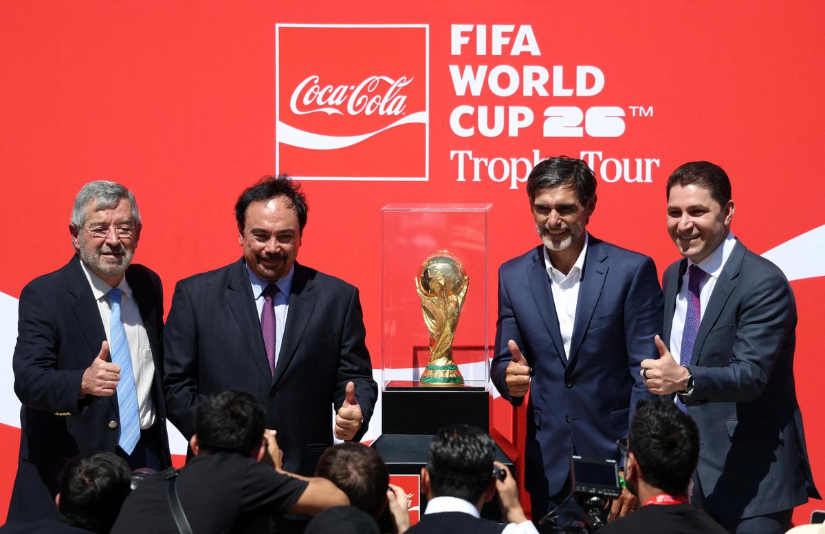 Former Argentina player Roberto Ayala, former Mexico player Hugo Sanchez, president of Coca Cola Mexico Louis Balat and Mexico's Foreign Minister Juan Ramon de la Fuente next to the FIFA World Cup trophy at the unveiling in Mexico, on February 27, 2026