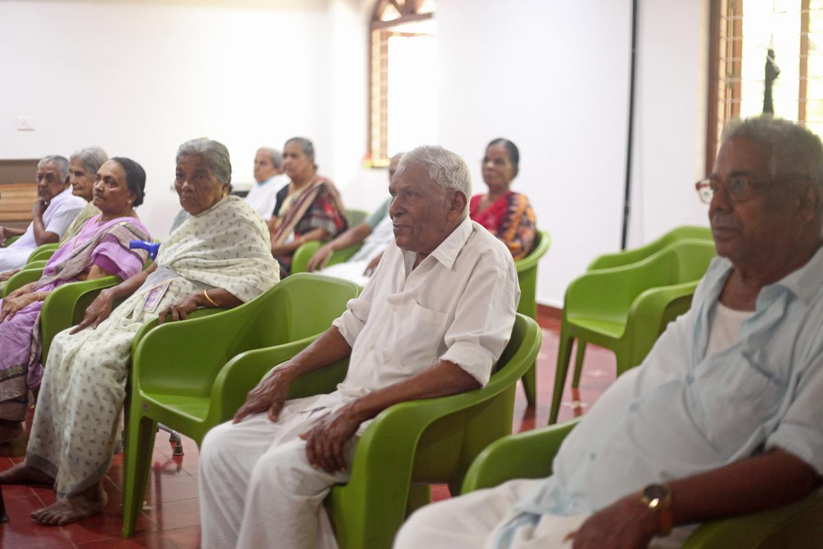     Kumaran (Center), 85, a former employee of Ulccs at Madithastu, an Bujru Day Care run by the Cooperative Society at Karkakkad, Kozhikode.