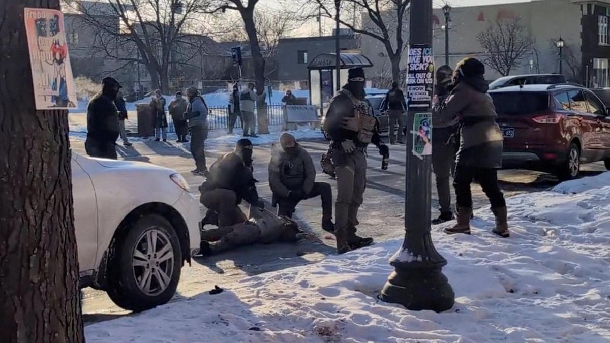 A screengrab from a video shows law enforcement officers kneeling next to the body of a man who was shot when federal agents were trying to detain him in Minneapolis, Minnesota, U.S., on January 24, 2026. 