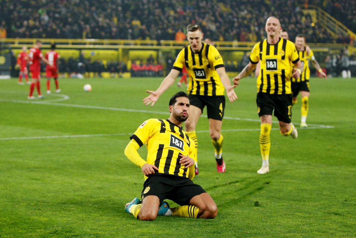 Borussia Dortmund’s Emre Can celebrates scoring their second goal.