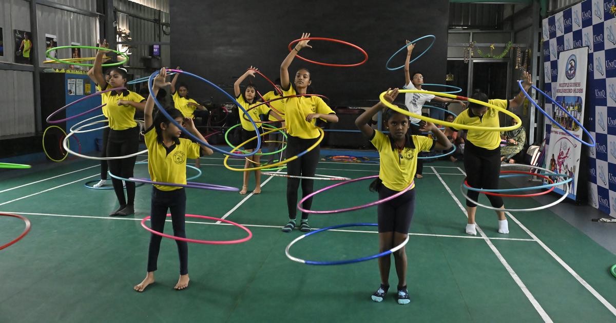 Students of ‘Chennai Hoopers’, a hula hooping school practice the art in Chennai.