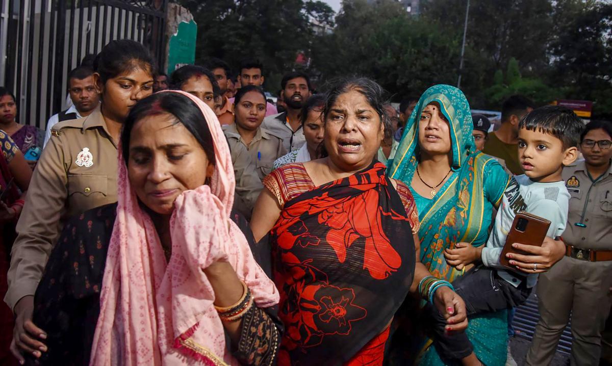 Mohit’s mother, Tapeshwari Devi (centre), outside the Ram Manohar Lohia Hospital in Lucknow. Photo: Special Arrangement