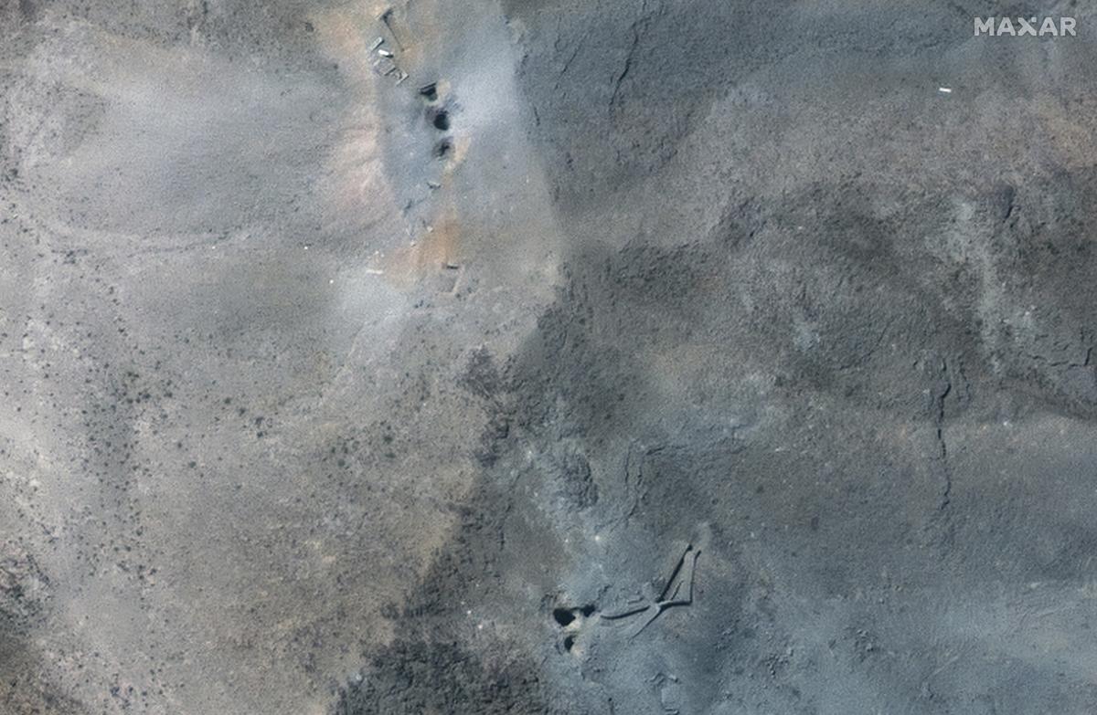 This satellite image provided by Maxar Technologies shows a close up view of holes and craters on a ridge at Fordo enrichment facility in Iran after U.S. strikes, on June 22, 2025. 