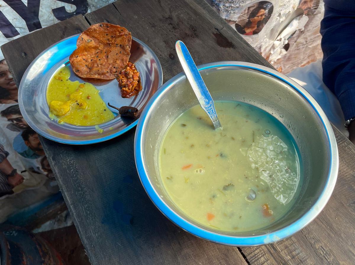 Masala kanji served with pappadavada, sun-dried curd chilli and pickles as sides