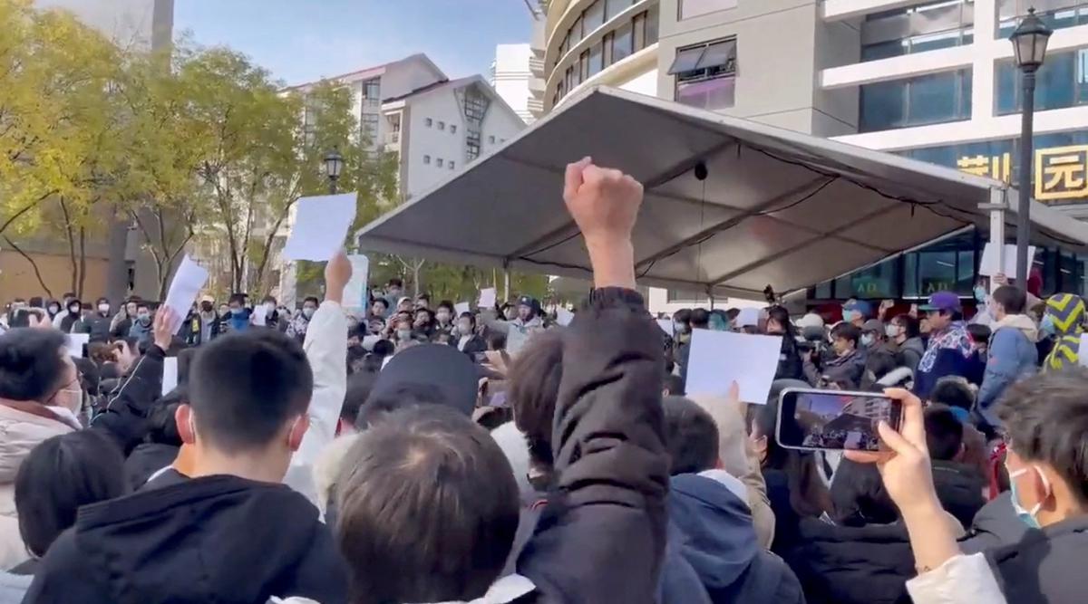 Students take part in a protest against COVID-19 curbs at Tsinghua University in Beijing, China seen in this still image taken from a video released on November 27, 2022 and obtained by Reuters. 