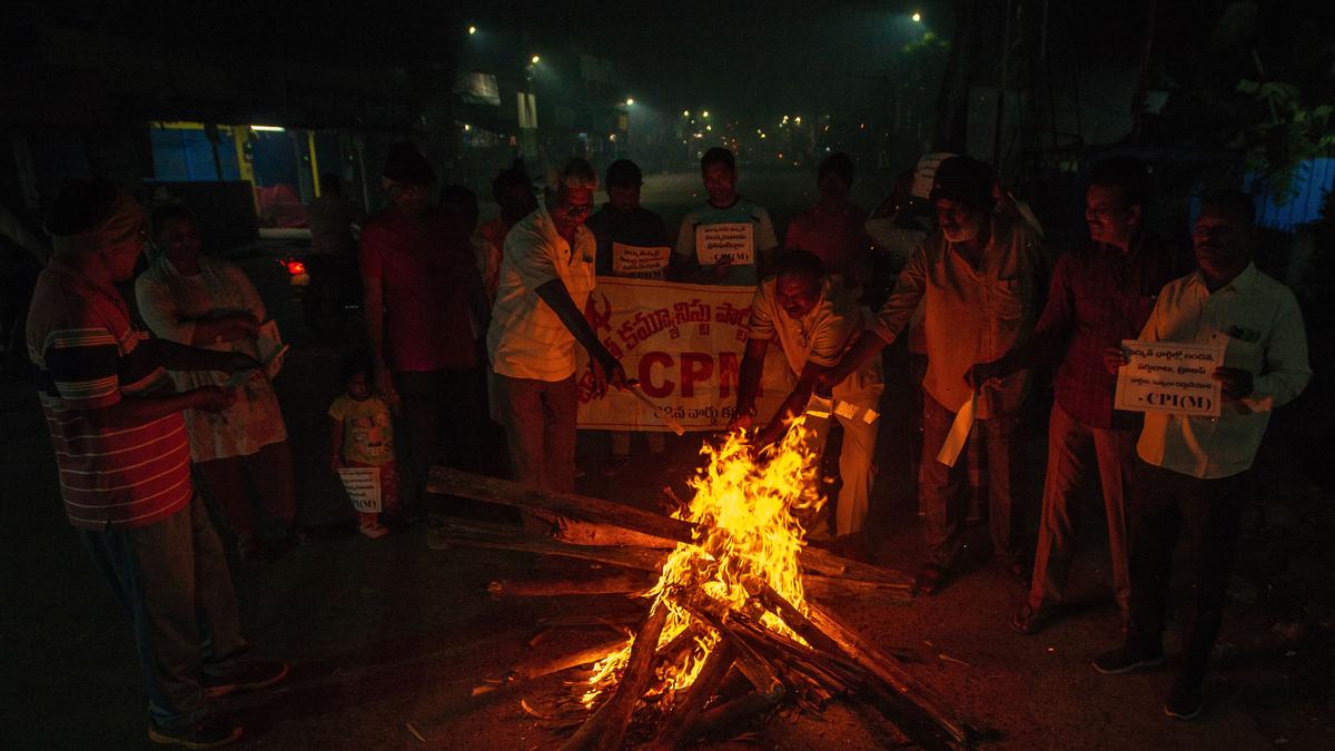 CPI(M) activists burn power bills in Bhogi fire in protest against hike in tariff in A.P.