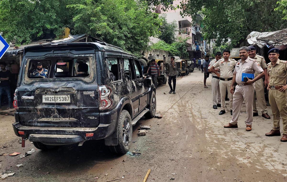 A car is vandalised after a violent clash erupted between two groups of Kanwariyas (Shiva devotees) over the issue of performing ‘Jalabhishek’, in Gurugram’s Sector 12 on Friday. Six persons were injured in the clash. 