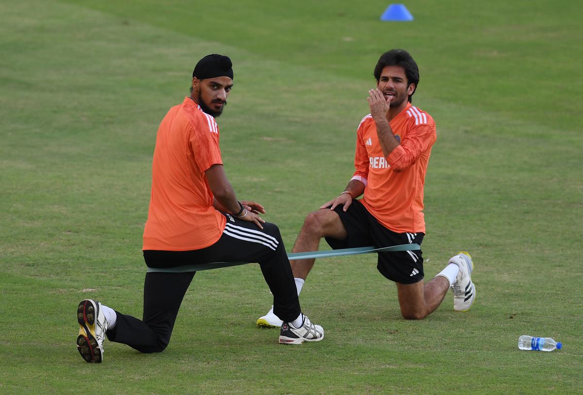 India’s Ravi Bishnoi (R) and Arshdeep Singh during practice session at the second T20 International match between India and Australia.