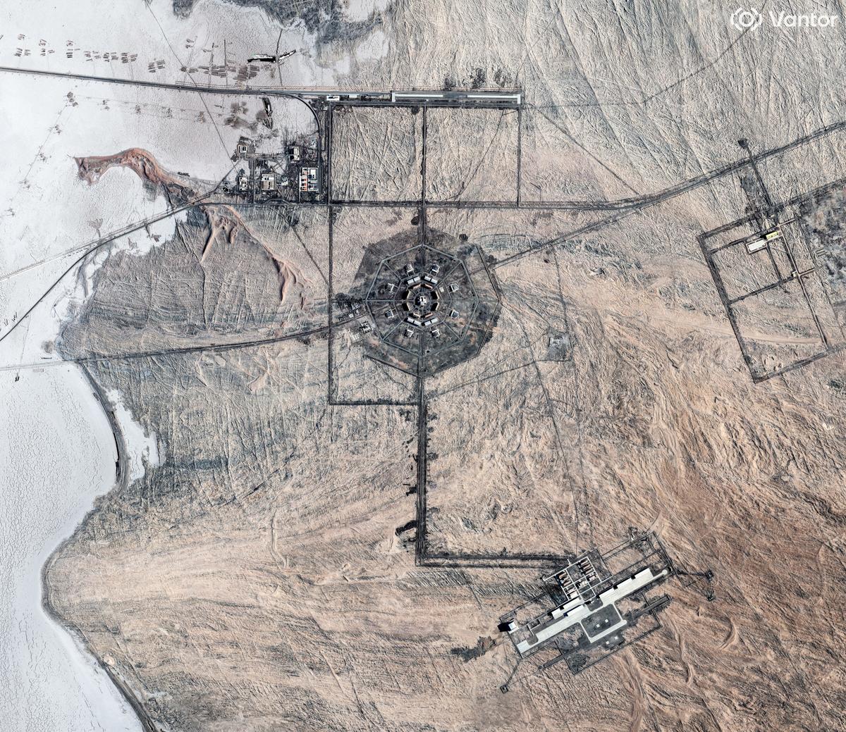 A satellite view shows one of the two Xinjiang octagon-shaped military facilities, which analysts say are likely supporting the nearby Hami silo fields, near an airfield to the south and a rail terminal to the north, in the Xinjiang Uyghur Autonomous Region, China.