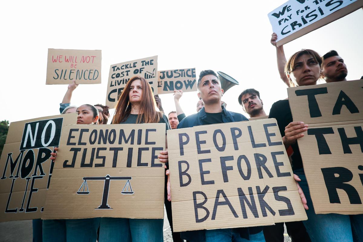 People protest against global inflation.