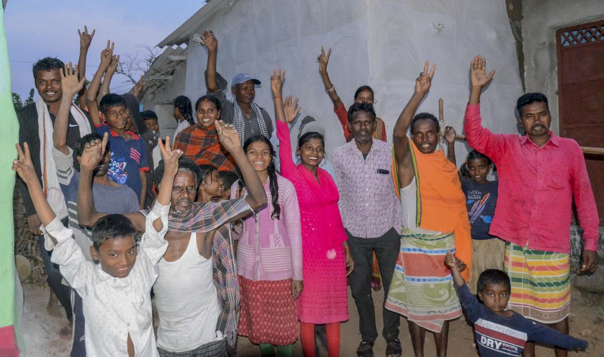 Relatives and family members of workers Sukhram Bediya, Naresh Bediya, Rajendra Bediya and Anil Bediya celebrate after their evacuation from the collapsed Silkyara Tunnel, in Khirabera village of Ranchi on November 28, 2023.