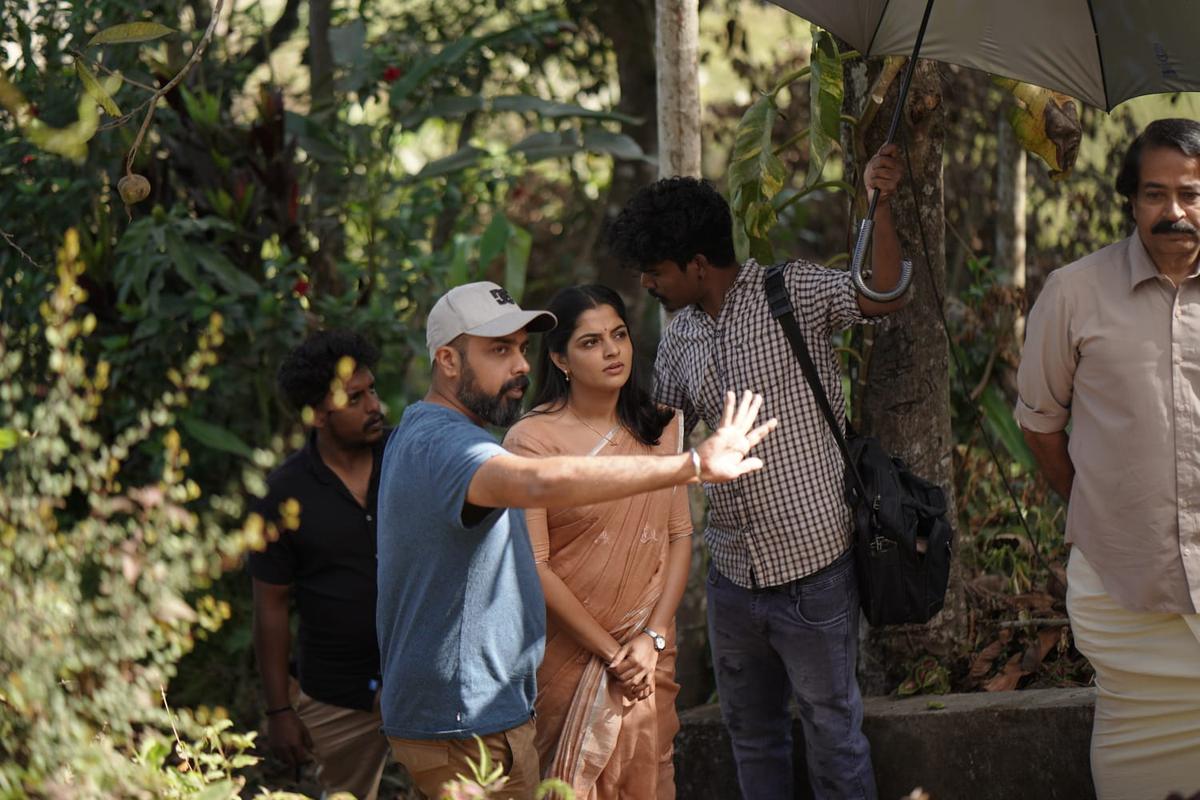 Director Praveen Chandran with Nikhila Vimal on the location of his web series Perilloor Premier League