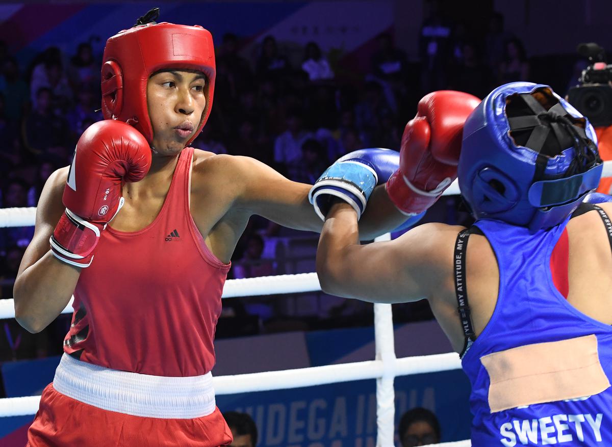 Lovlina Borgohain of Assam (Red) during her gold medal winning bout against Sweety of Haryana in the middle weight category of women’s boxing during the 36th National Games at Gandhinagar in Gujarat on October 12, 2022.