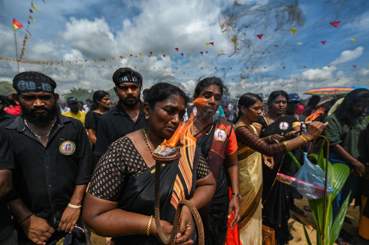 Tamil people participate in a remembrance ceremony in Mullivaikkal village in Sri Lanka.