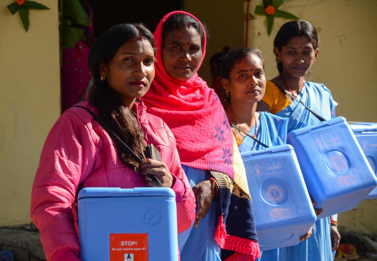 Pashu Sahis displaying vaccine boxes at a collection center in Tamar, Ranchi.