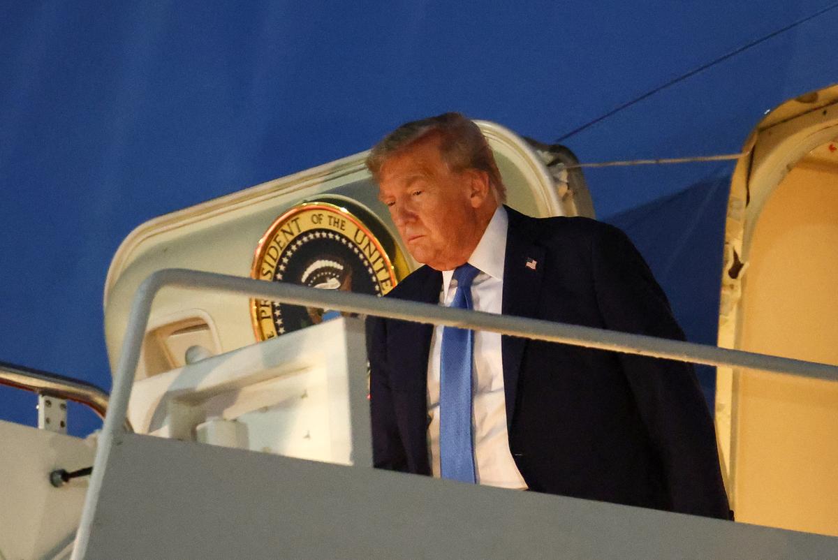 U.S. President Donald Trump disembarks Air Force One after returning early from the G7 Leaders’ Summit in Canada, at Joint BaEUTERS/Kevin Lamarque