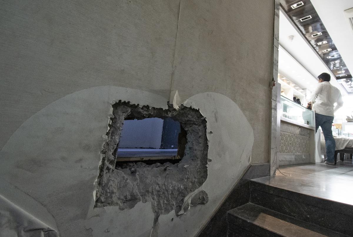 The 1x1.5-foot hole drilled in the store’s strongroom