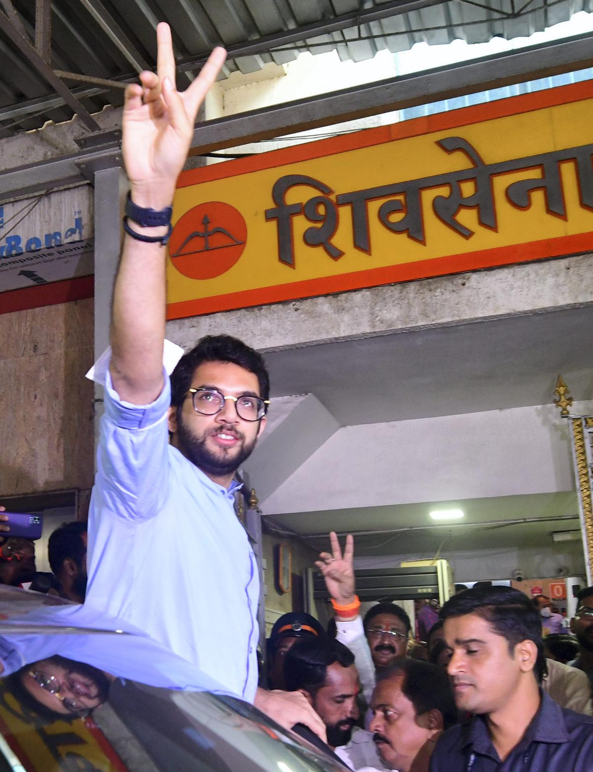 Aaditya Thackeray flashes the victory sign as he comes out of Sena Bhavan after a meeting on June 24.