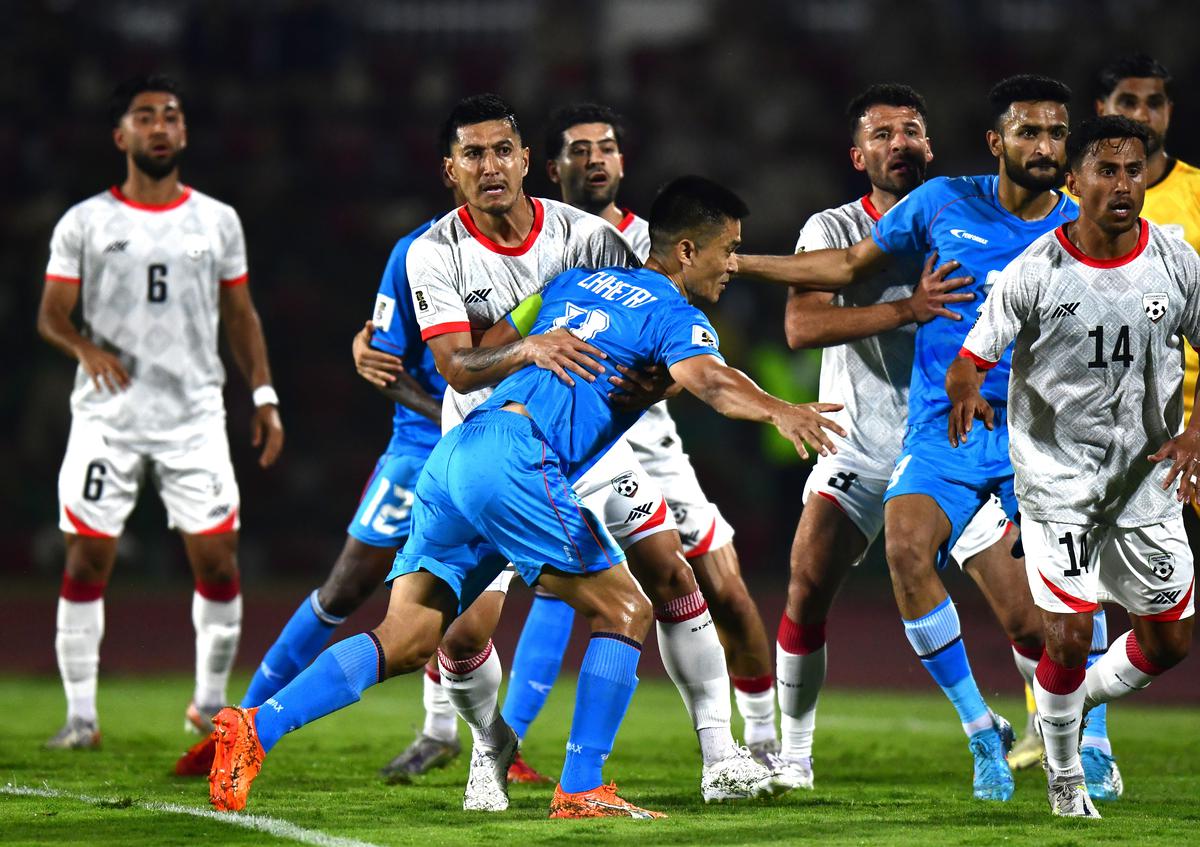 

Indian captain Sunil Chhetri is held back the Afghanistan defence during a set-piece in the World Cup qualifying match in Guwahati on Tuesday, 26 March 2024. 